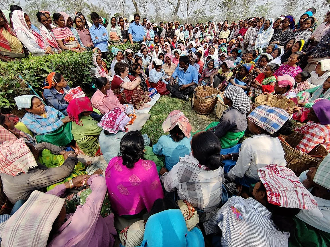 Priyanka Gandhi Vadra sitting with tea garden workers at Sadhuru tea garden, Biswanath, Assam.