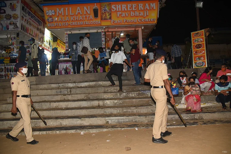 Police constables urge people to leave Juhu beach in view of coronavirus pandemic, in Mumbai