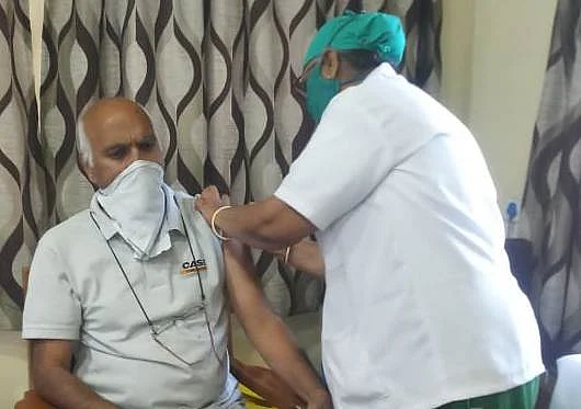Ravi Kumar Jain, 65, was the first person to be vaccinated at MY Hospital corona vaccination centre in Indore on Monday