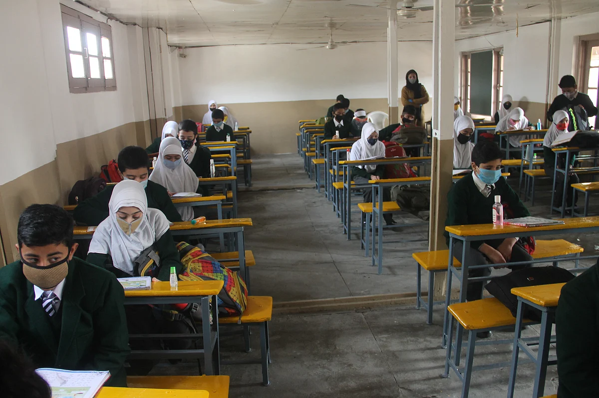 Students while maintaining social distance attend a class in Srinagar,Kashmir on March 15, 2021.