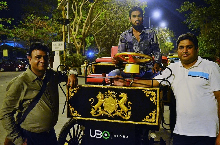 Bareilly-based Tushar Goel (left) and Sanjay Jhawar experienced the e-buggy ride for the first time with driver Irfan Desai (centre)