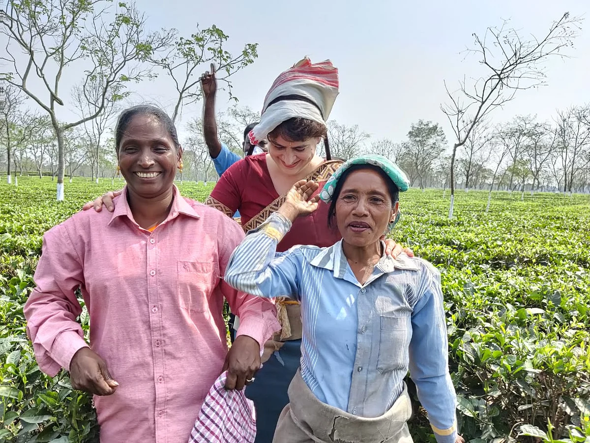 Priyanka Gandhi Vadra sharing a laugh with tea plantation workers at the Sadharu Estate, Biswanath, Assam.