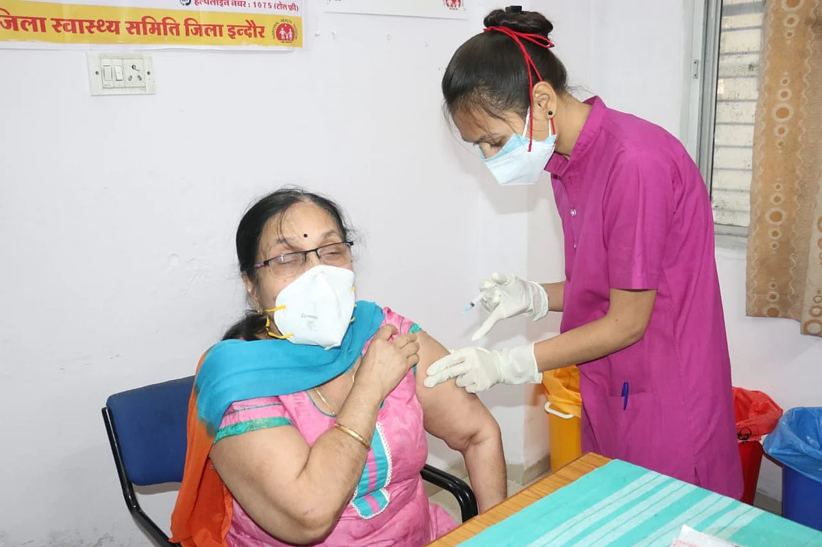 Woman being inoculated at PC Sethi Hospital