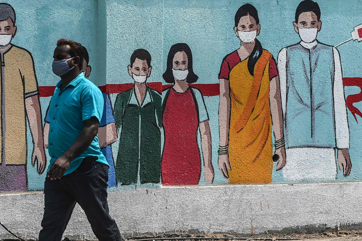 A pedestrian walks past a wall mural depicting medical staff as frontline Covid-19 coronavirus warriors, amidst rising Covid-19 coronavirus cases, in Mumbai on March 29, 2021.
(Representative Photo)