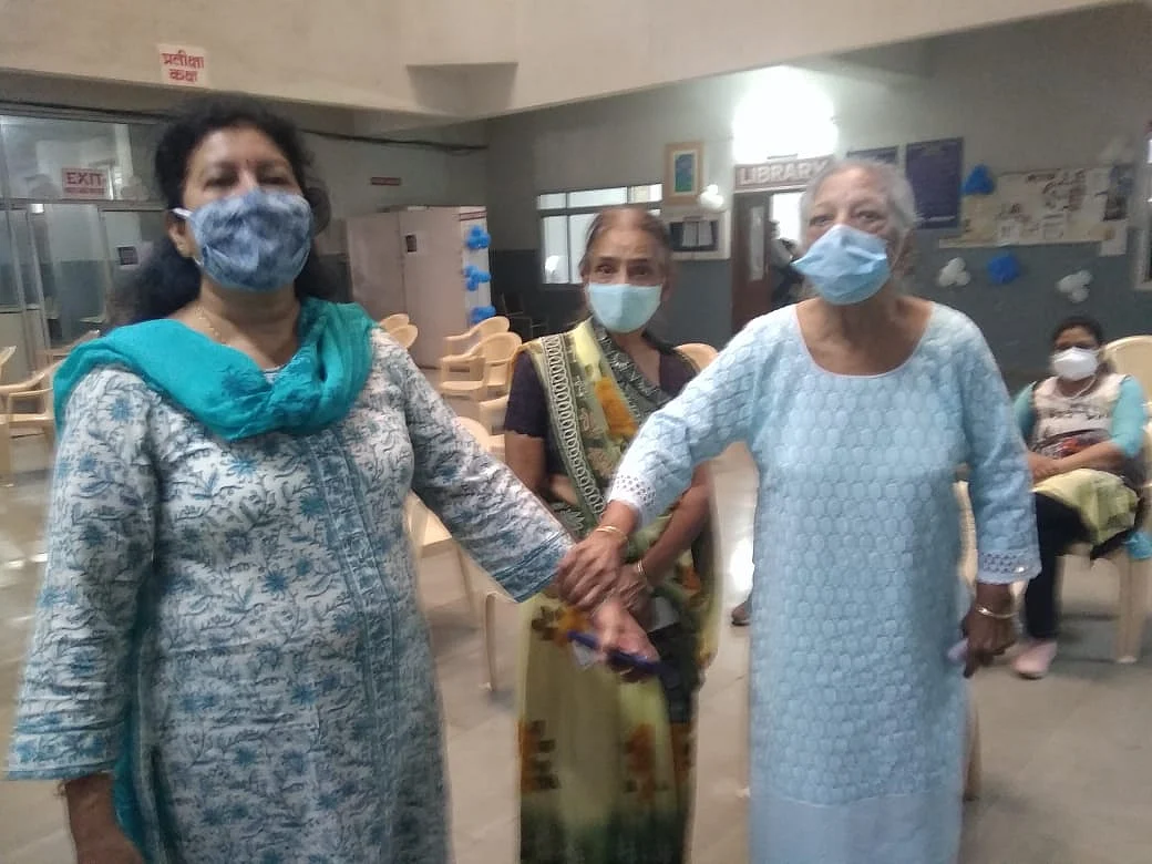 An elderly woman walks into vaccination centre at Aurobindo hospital in Indore on Monday