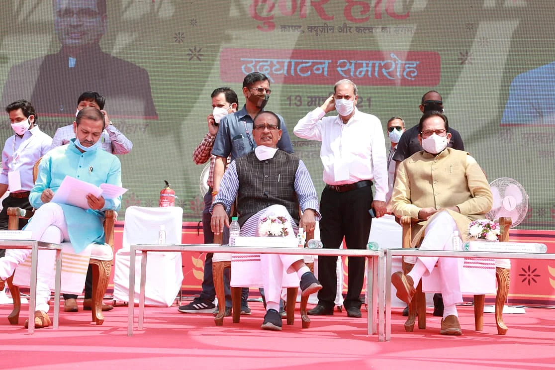 Chief minister Shivraj Singh Chouhan, Union Minister for Minority Affairs Mukhtar Abbas Naqvi look at products at Hunar Haat inaugural function in Bhopal on Saturday