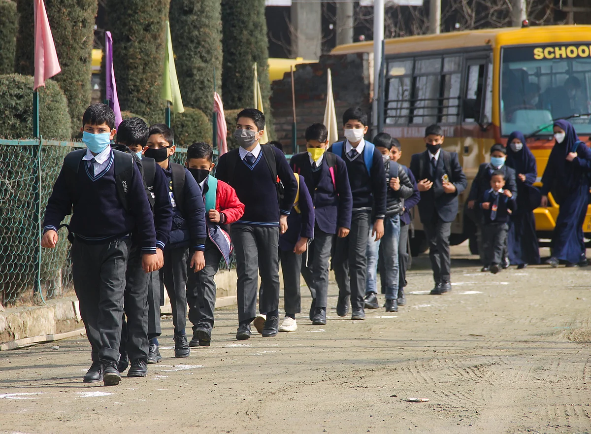 Students of junior wing attending classes on the first day of school as they reopen after almost a year, at Srinagar, kashmir.