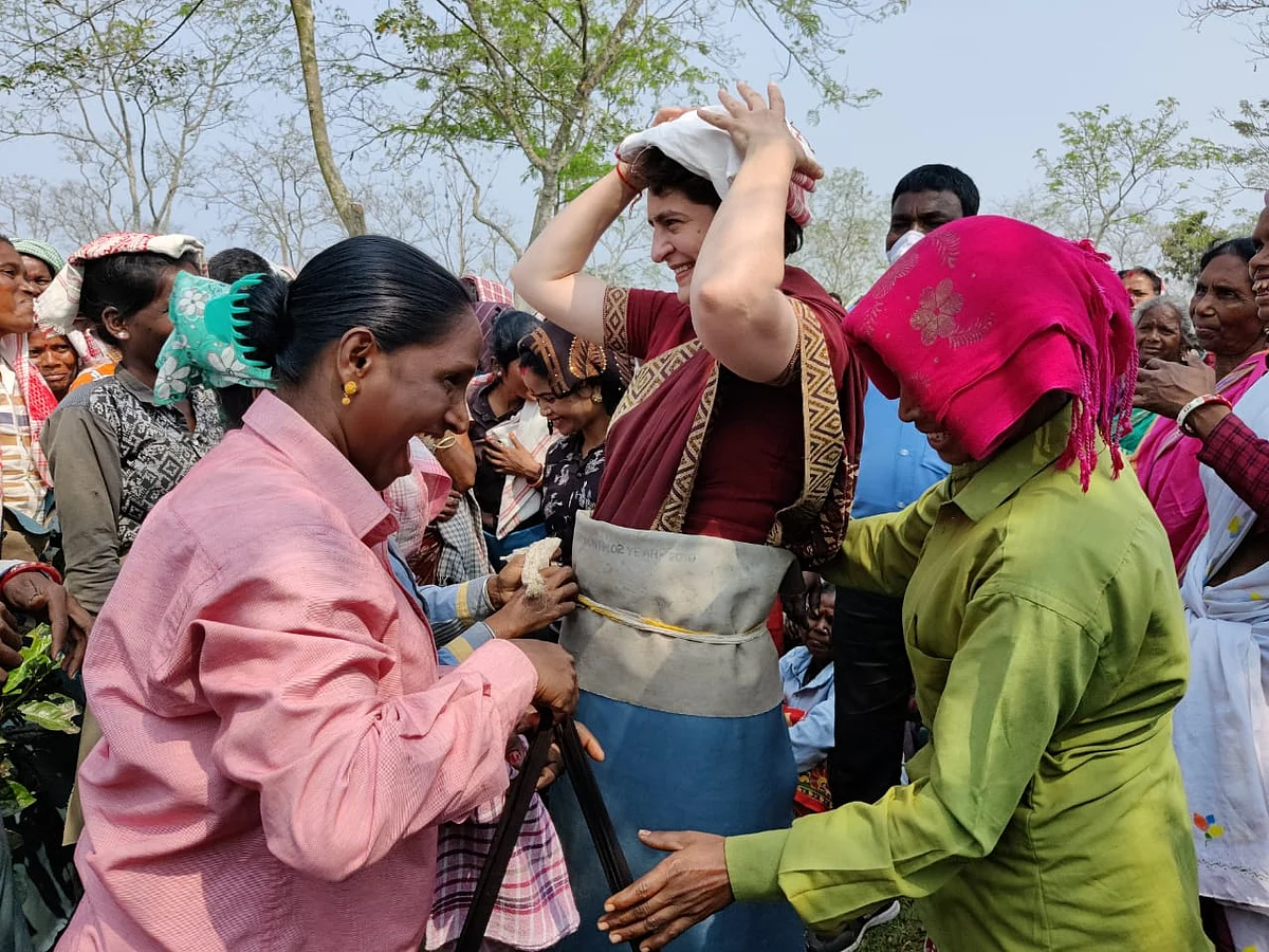 Priyanka Gandhi Vadra sharing a laugh with tea plantation workers at the Sadharu Estate, Biswanath, Assam.