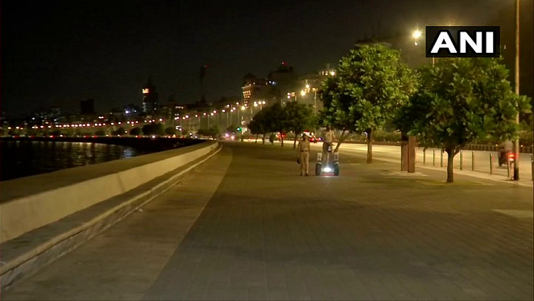 Police officials seen patroling during the curfew at the famous Marine Drive