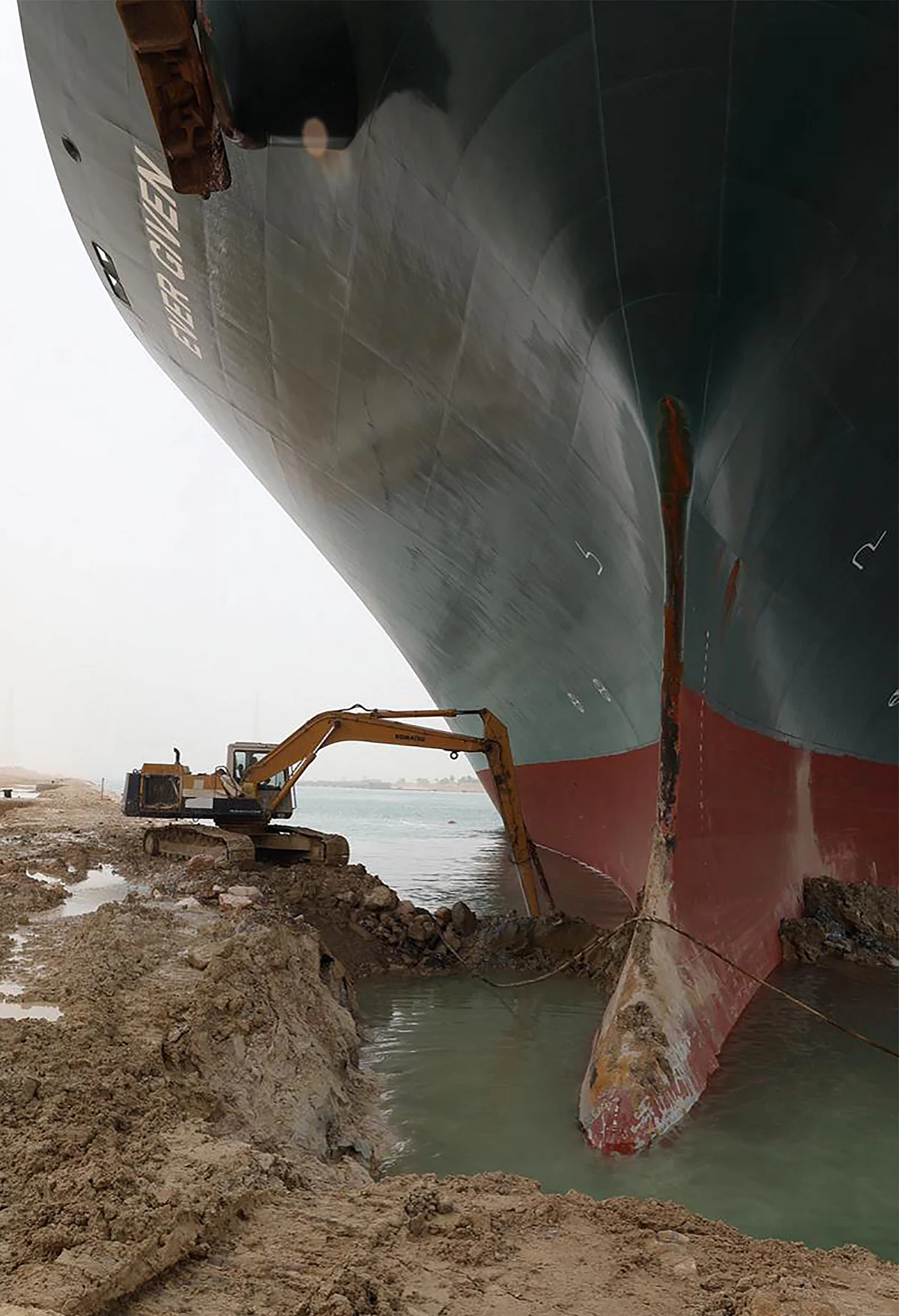 A handout picture released by the Suez Canal Authority on March 25, 2021 shows the Taiwan-owned MV Ever Given lodged sideways and impeding all traffic across the waterway