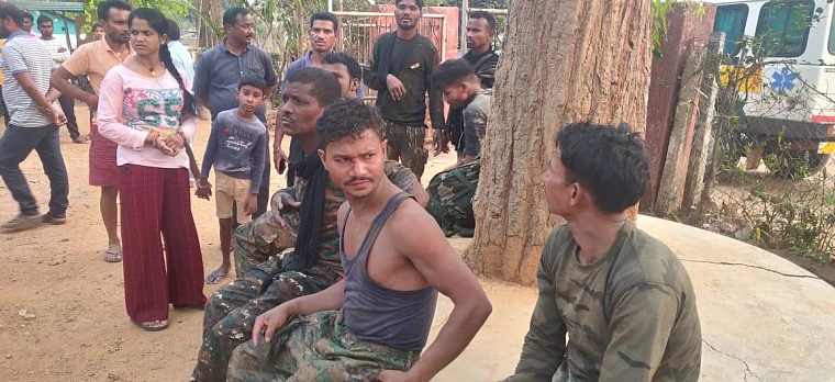 Jawans injured in the attack wait to be lifted by security forces