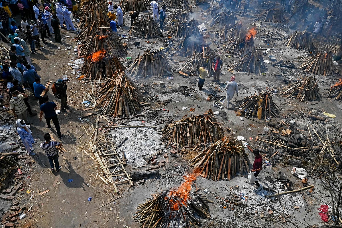 Burning funeral pyres can be seen of the patients who died of the Covid-19 coronavirus at a crematorium in New Delhi on April 27, 2021.