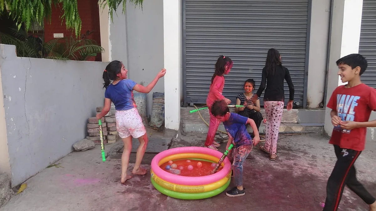 Children play with colours on Rangpanchami in Indore on Friday