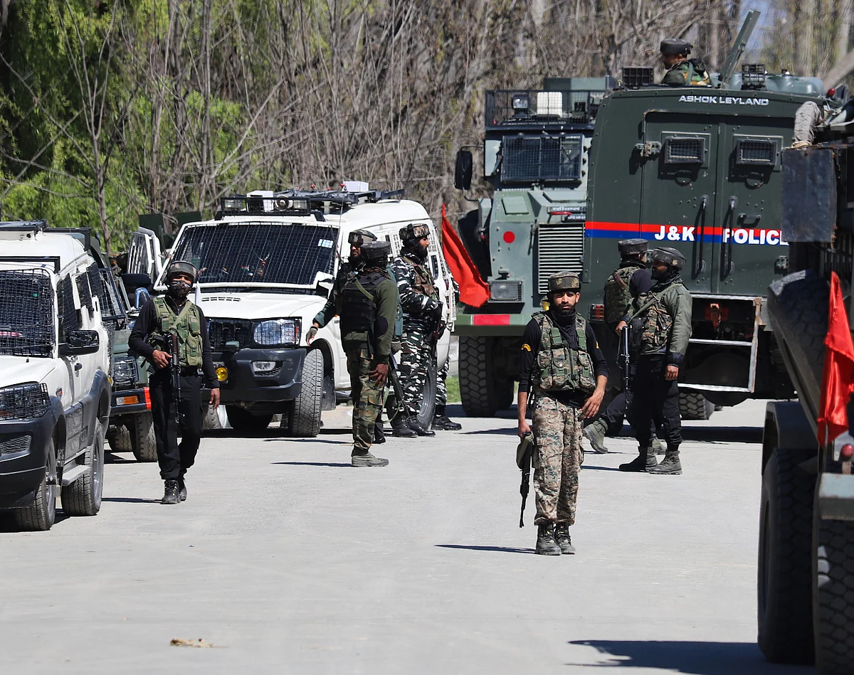 Army soldiers stand guard during an encounter with suspected militants in Pulwama district of South Kashmir.