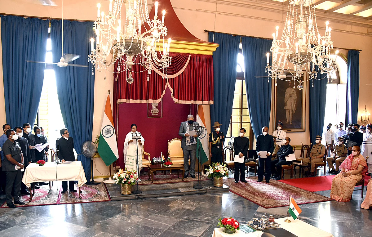 TMC supremo Mamata Banerjee takes oath as Chief Minister of West Bengal for a third consecutive term, at Raj Bhavan in Kolkata on Wednesday. She was administered the oath by Governor Jagdeep Dhankhar.