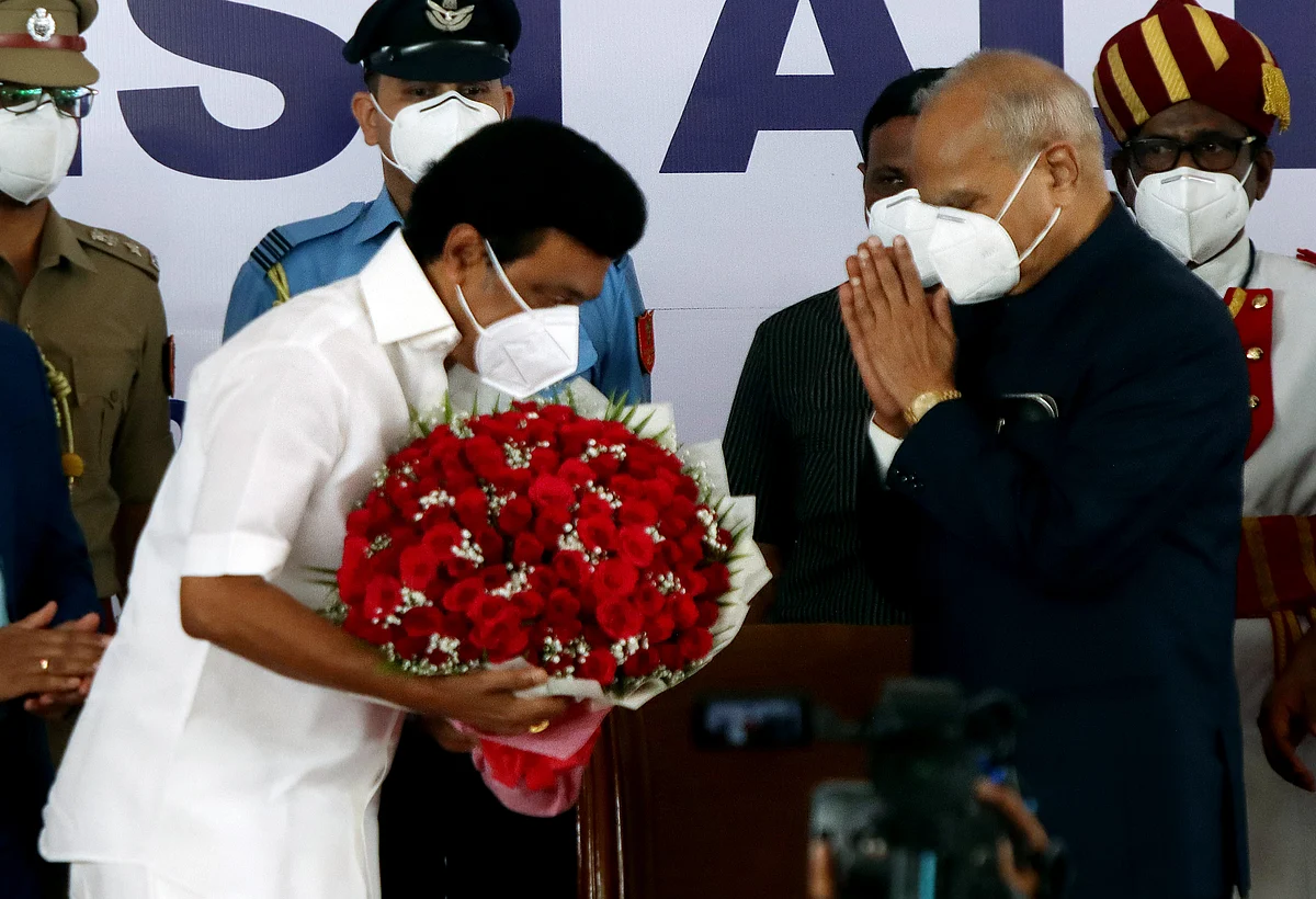 DMK Chief MK Stalin being felicitated with flowers by Governor Banwarilal Purohit following his oath ceremony as the Chief Minister of Tamil Nadu, at Raj Bhavan in Chennai on Friday.