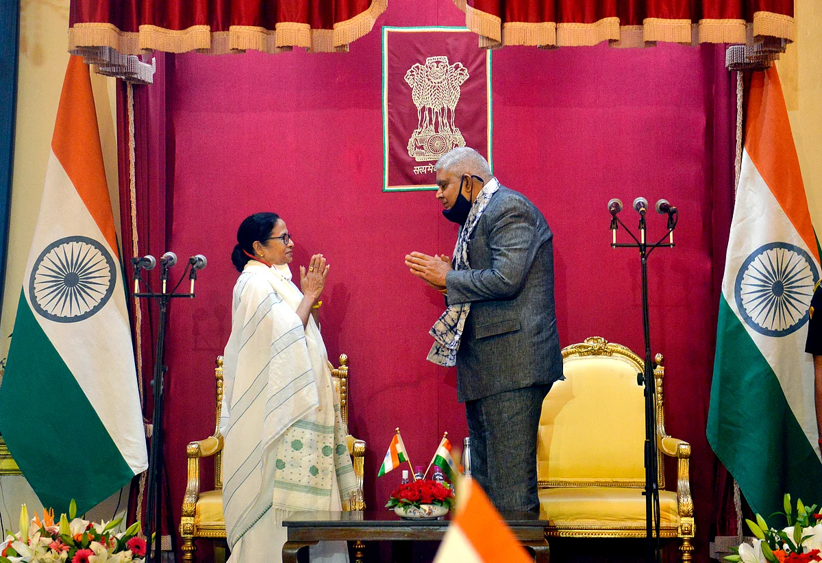TMC supremo Mamata Banerjee makes a gesture to Governor Jagdeep Dhankhar after taking oath as Chief Minister of West Bengal for a third consecutive term, at Raj Bhavan in Kolkata on Wednesday.