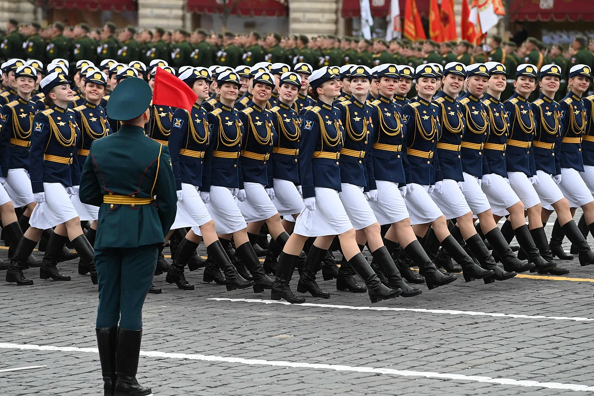 Russian servicewomen march along Red Square during the Victory Day military parade in Moscow on May 9, 2021.