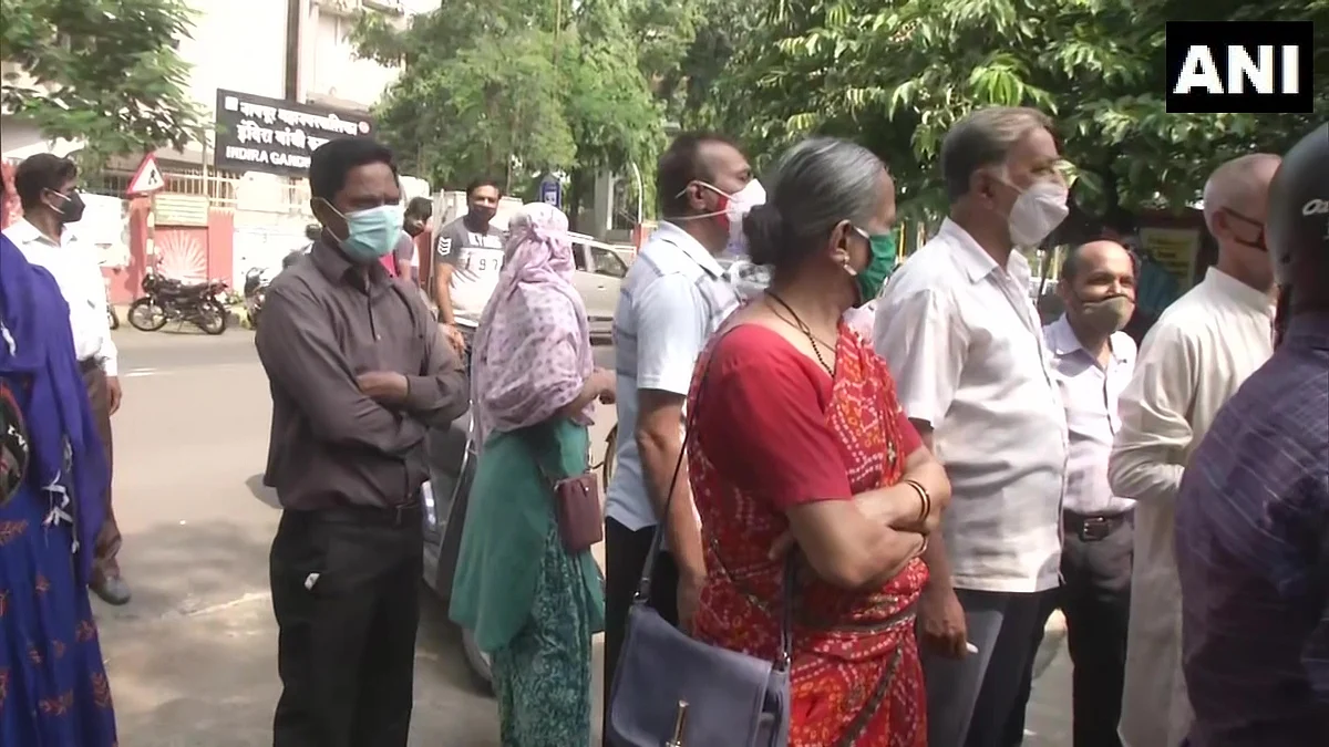 People gather outisde a Covid-19 vaccination centre in Nagpur that was closed due to the vaccine shortage on Wednesday, June 30, 2021.