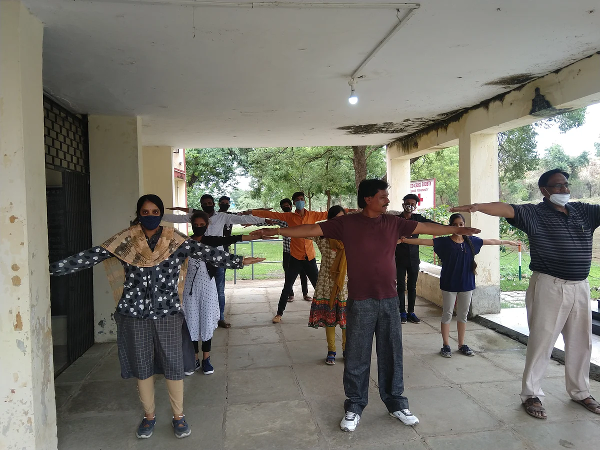 On the occasion of International Yoga Day students practiced yoga at Government College following social distance on Monday