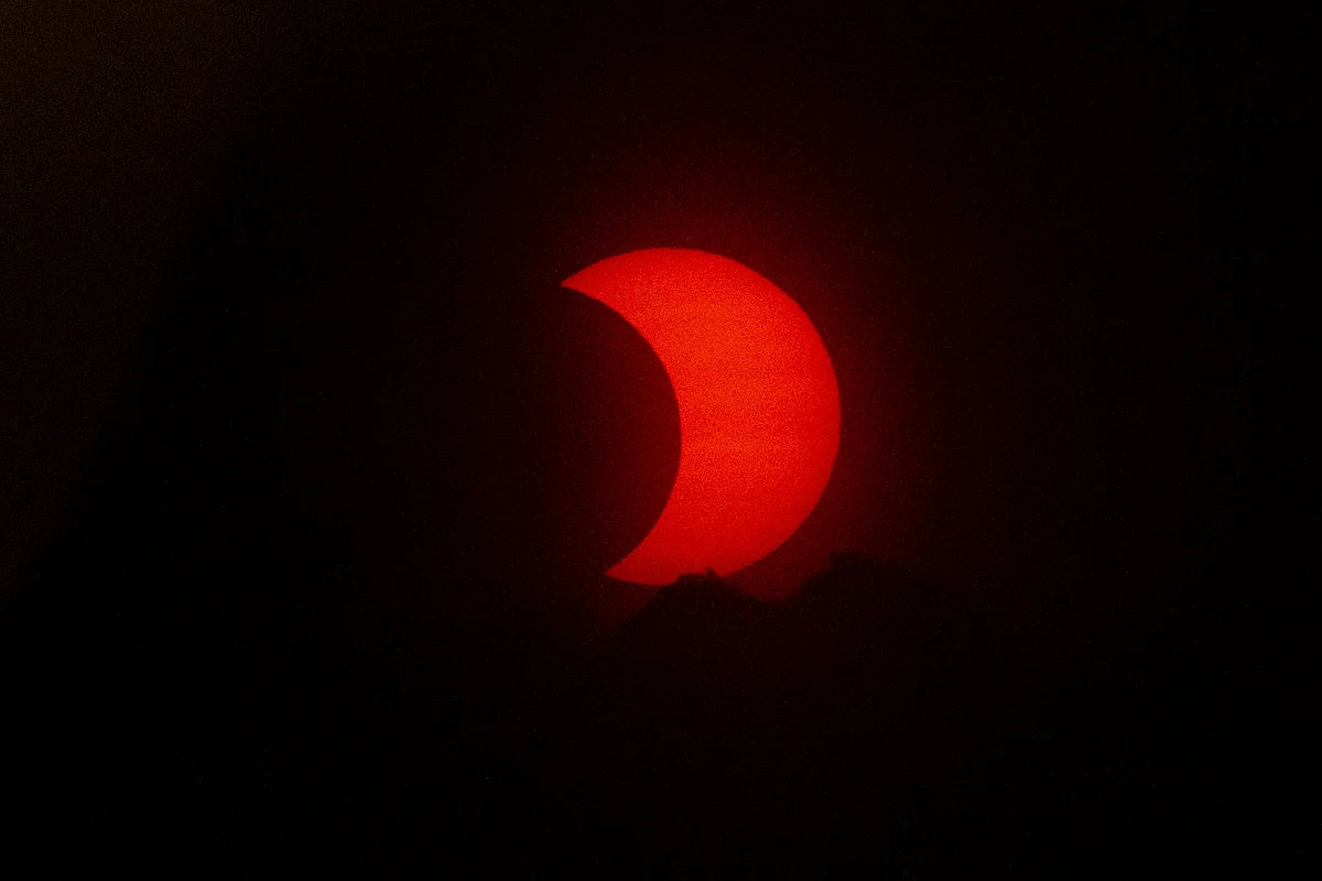 A eclipsed sun rises over New York City on June 10, 2021 seen from Jersey City, New Jersey.