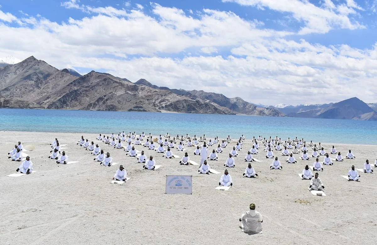 Police (ITBP) performs Yoga alongside Pangong Tso lake in Ladakh, on the occasion of International Yoga Day.