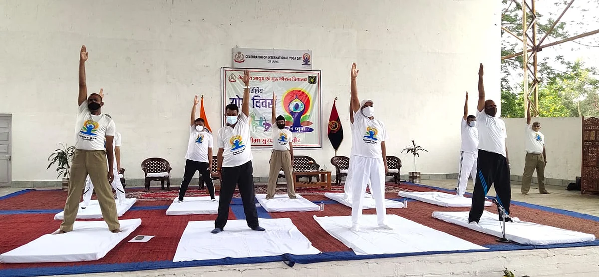 Minister Tulsi Silawat (second from left) performing yoga in Indore on Monday