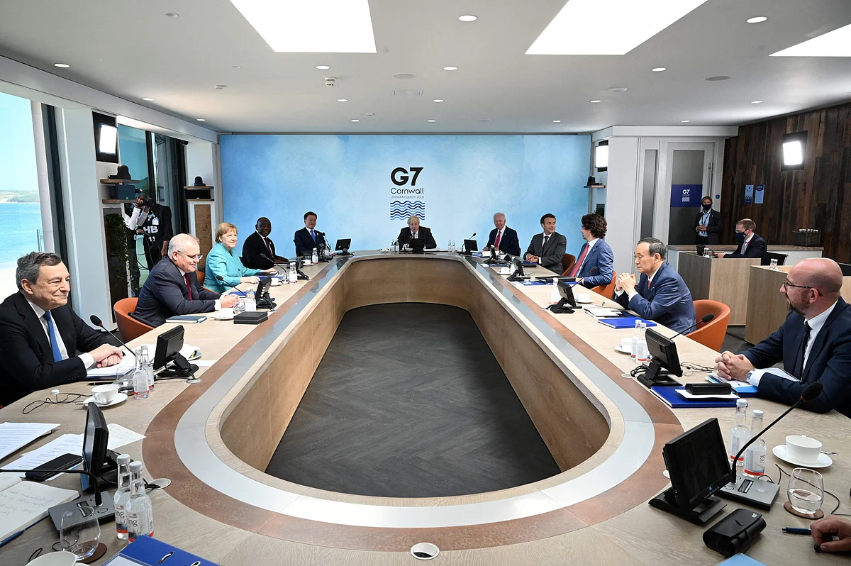 (From centre clockwise) British Prime Minister Boris Johnson, US President Joe Biden, Frances President Emmanuel Macron, Canadas Prime Minister Justin Trudeau, Japans Prime Minister Yoshihide Suga, President of the European Council Charles Michel, Italys Prime minister Mario Draghi, Australias Prime Minister Scott Morrison, Germanys Chancellor Angela Merkel, South Africas President Cyril Ramaphosa and South Koreas President Moon Jae-in attend a working sesssion at the G7 summit in Carbis Bay, Cornwall on June 12, 2021.
