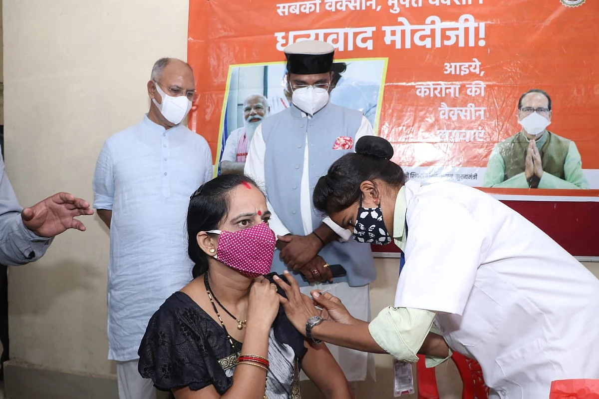 Medical education minister Vishvas Sarang at vaccination centre in Polytechnic College in Bhopal on Monday. Also seen is senior BJP functionary Suhas Bhagat (L)