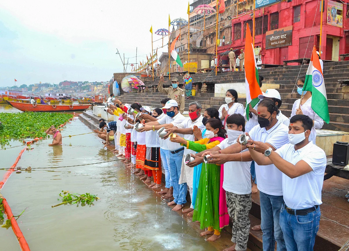 Namami Gange activists offer prayers at Ganga Ghat on the occasion of the Ganga Dussehra festival in the ongoing Covid-induced lockdown, in Varanasi, Sunday, June 20, 2021.