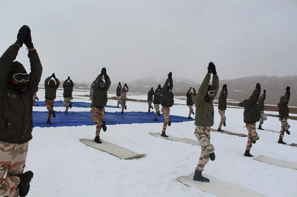 ITBP (Indo-Tibetan Border Police) personnel perform Yoga at an altitude of 18,000 ft in Ladakh, on International Day Of Yoga.