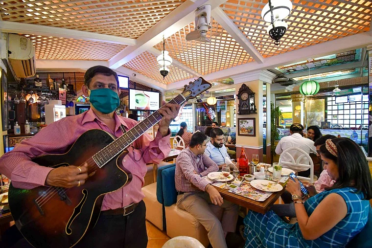 Mahim's Goa Portuguesa hotel staff welcome customer by singing songs
