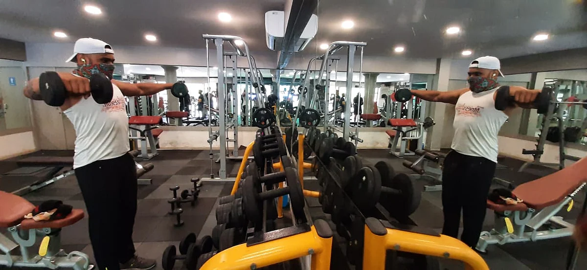 People were seen training at a local gym in Gorai, Mumbai on Monday after the government announced the easing of COVID-induced restrictions in Mumbai.