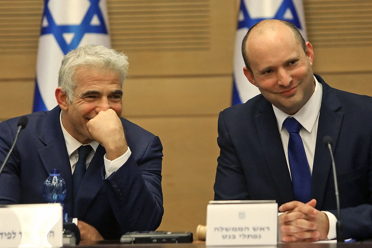 Israels incoming Prime Minister Naftali Bennett and Alternate Prime Minister and Foreign Minister Yair Lapid look on during an address at the Knesset in Jerusalem on June 13, 2021.
