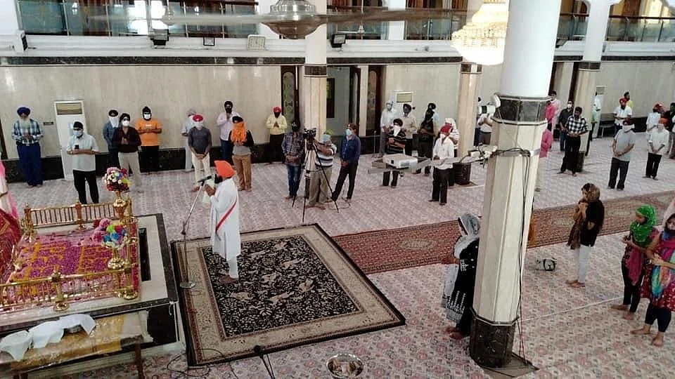 Devotees offering prayers at Imli Sahib Ji gurdwara on Sunday