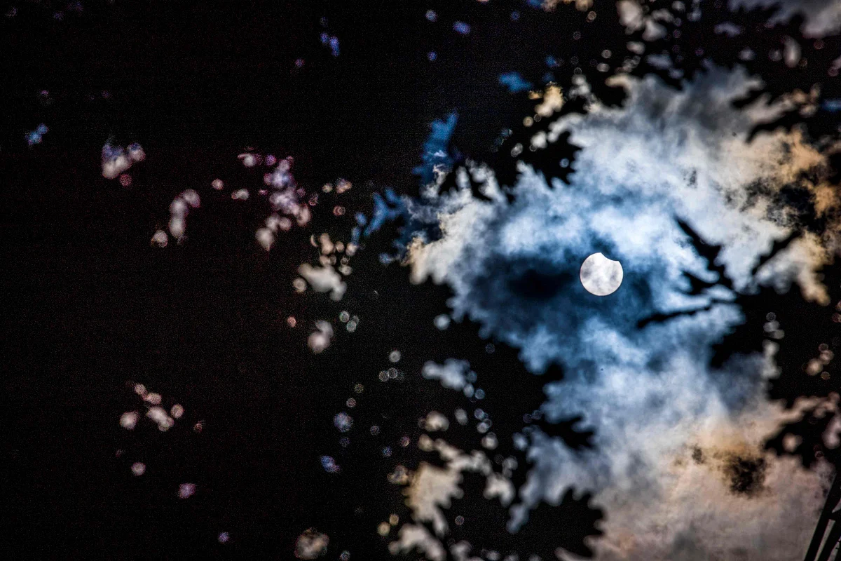 A picture taken on 10 June 2021 in Brussels shows a partial solar eclipse. - The phenomenon occurs when the moon gets between the earth and the sun and the moon casts a shadow over the sun. The partial eclipse will be visible over the Earths northern hemisphere.