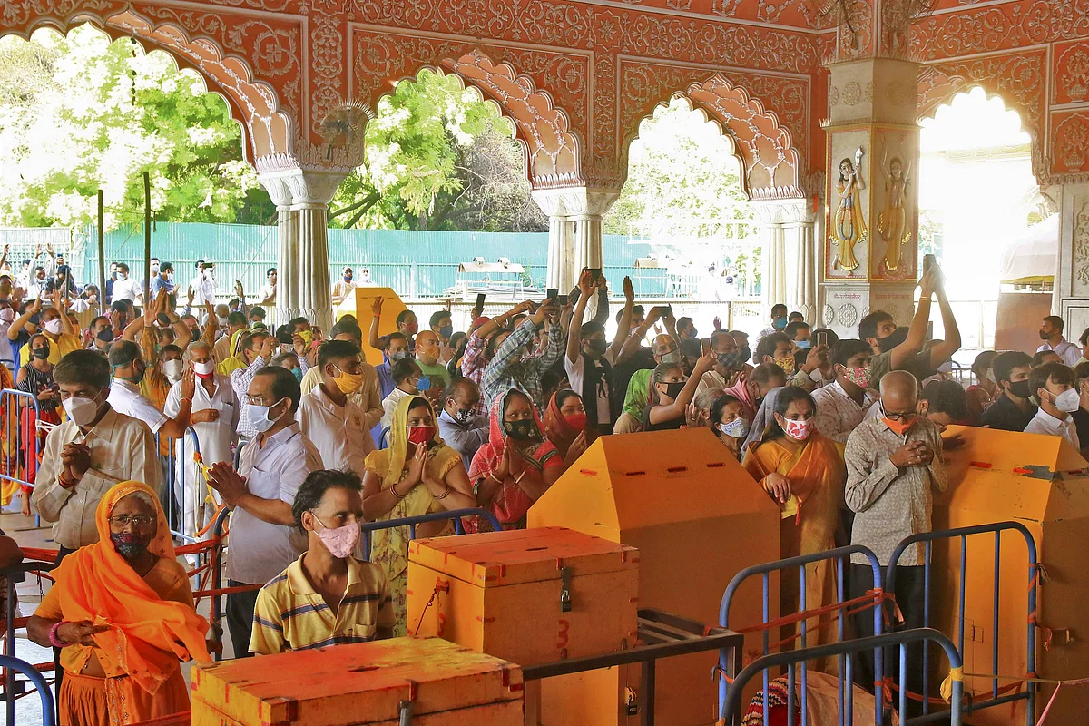 Devotees visit Govind Dev Ji temple after authorities eased COVID-induced restrictions in Jaipur, Rajasthan on Monday, June 28, 2021.