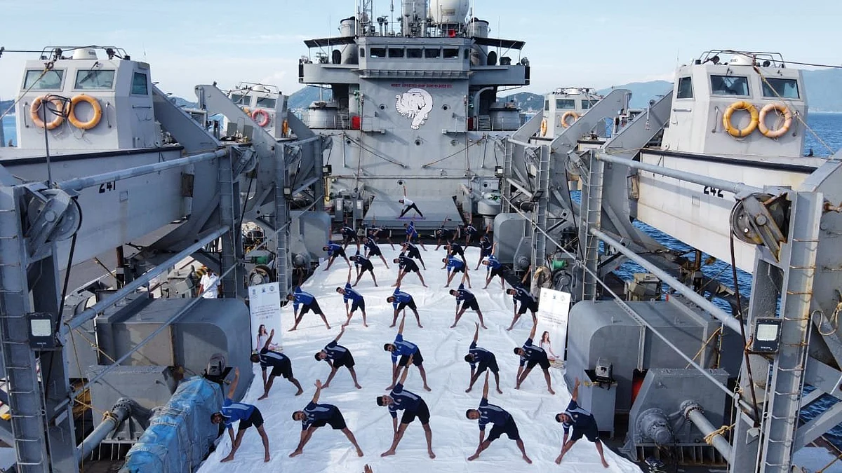 Indian Navy personnel, onboard INS Airavat and deployed at Cam Ranh Bay in Vietnam, perform Yoga on International Day Of Yoga 2021.