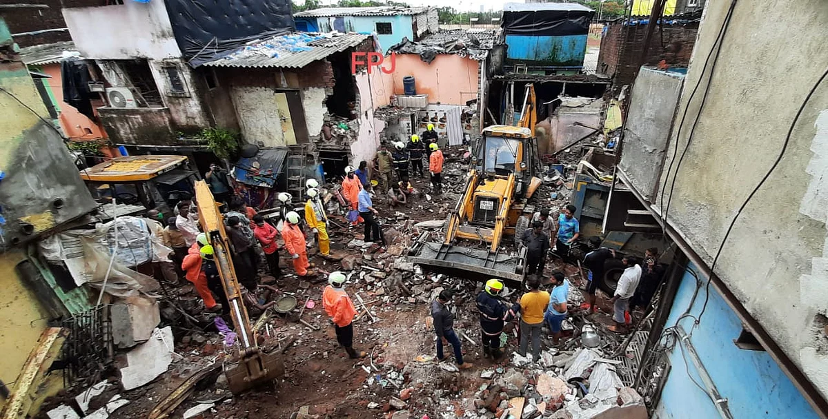 Rescue operation underway after a single-storey house collapsed on another structure in Malwani area on Wednesday night, in Mumbai, Thursday, June 10, 2021. At least eight children and three adults were killed and seven other people injured in the mishap.