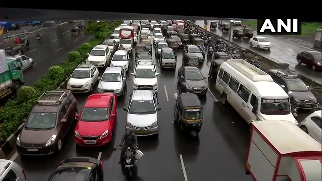 Heavy rainfall in Mumbai causes traffic snarls in different parts of the city on Wednesday. Visuals from Western Express Highway.