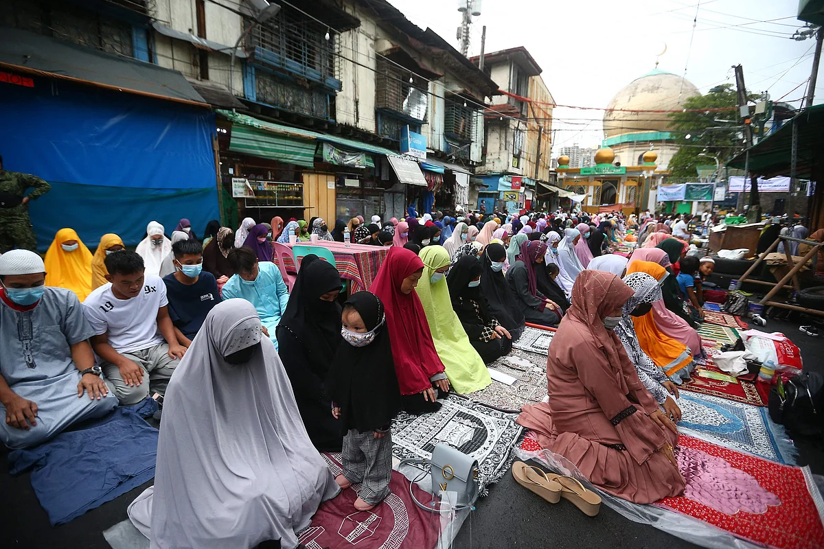Filipino Muslims offer prayers to mark Eid al-Adha outside a mosque in Manila City, suburban Manila on July 20, 2021.