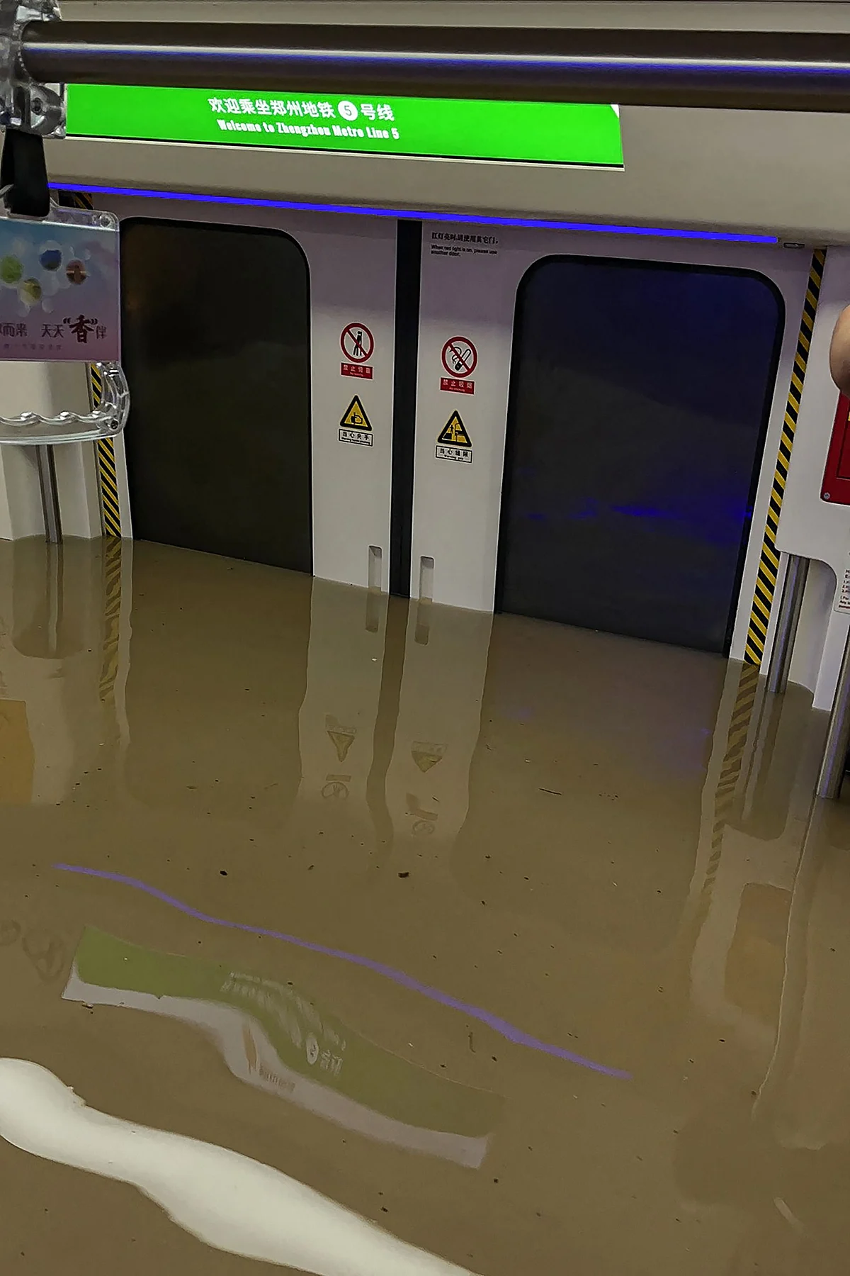 This handout photo taken on July 20, 2021 and received on July 21 courtesy of Weibo user merakiZz-, shows a submerged subway car following heavy rains in Zhengzhou, in Chinas central Henan province.