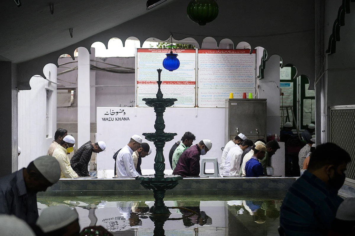 Muslim devotees offer prayers during the Eid al-Adha or the Festival of Sacrifice, in Hyderabad on July 21, 2021.