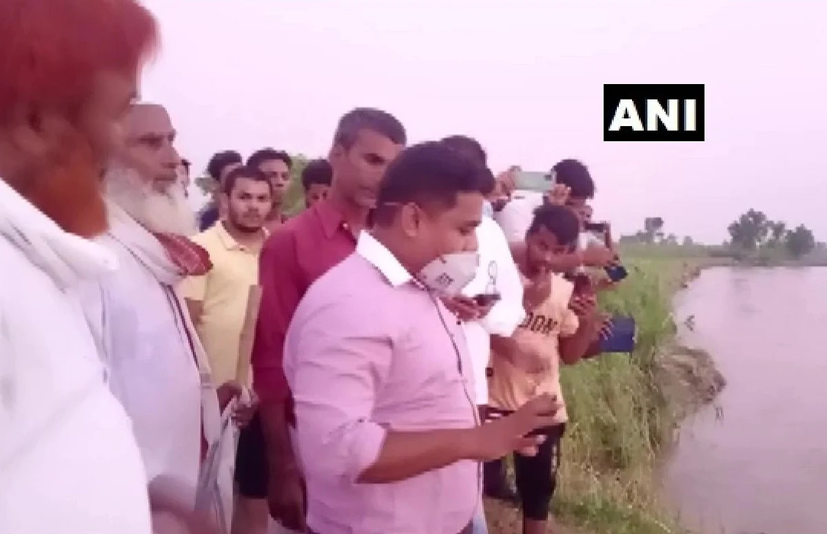 Bagaha SDM Shekhar Anand rode a buffalo cart to reach a river embankment in the flood-affected Ramnagar area in East Champaran, Bihar on July 5, 2021.