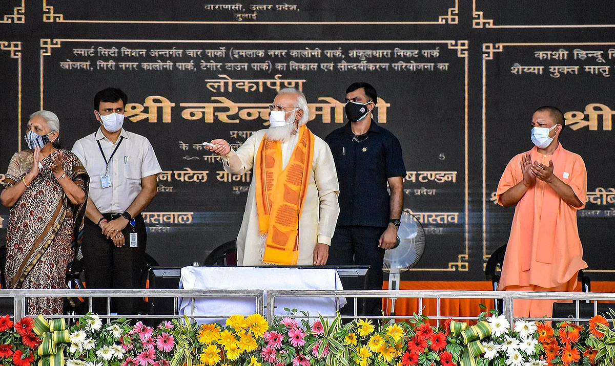 Varanasi: Prime Minister Narendra Modi with UP Chief Minister Yogi Adityanath and state Governor Anandiben Patel during inauguration of various developmental projects, at BHU Ground in Varanasi, Thursday, July 15, 2021.