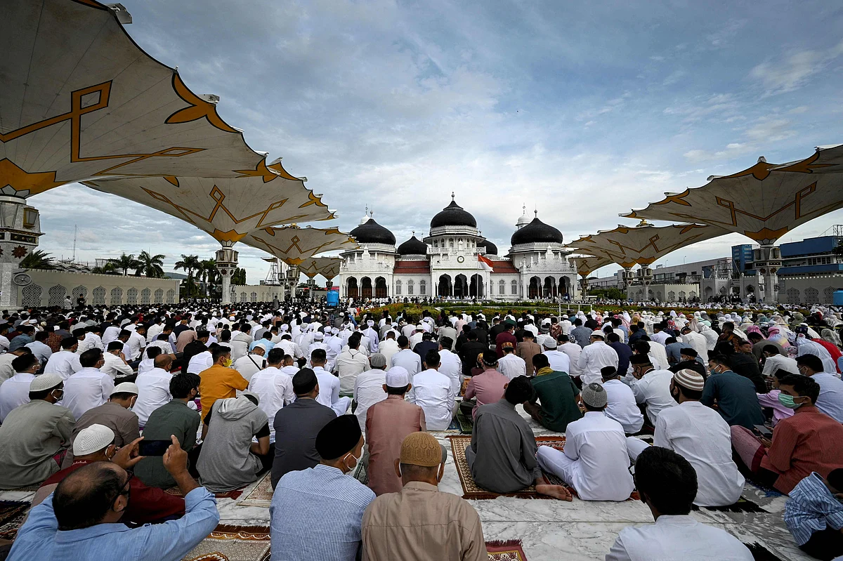 Muslims attend prayers to mark the Eid al-Adha festival at the Baiturrahman Grand Mosque in Banda Aceh on July 20, 2021.
