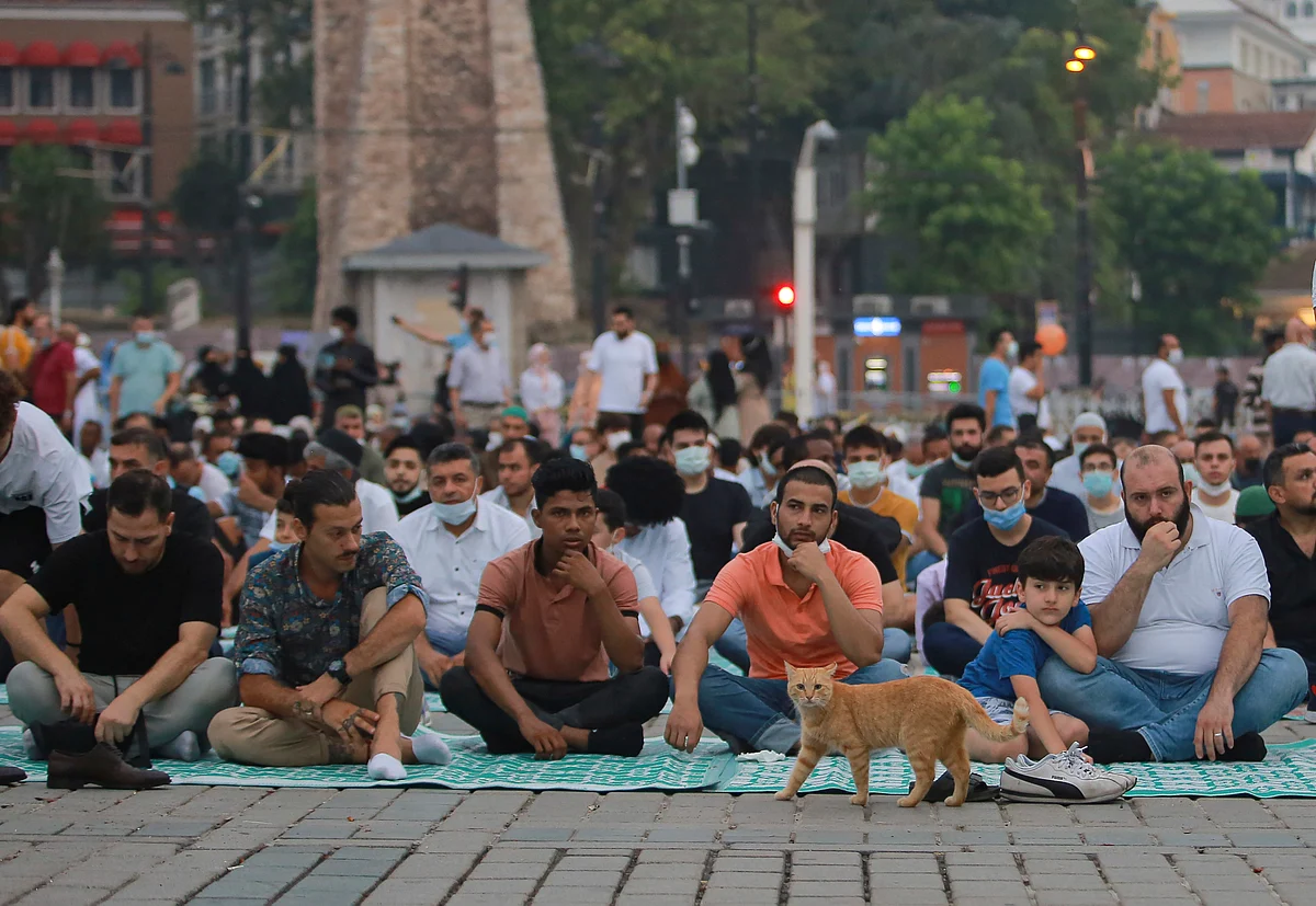 Muslims offer prayers during the first day of Eid al-Adha, outside the iconic Haghia Sophia in the historic Sultan Ahmed district of Istanbul, Tuesday, July 20, 2021.