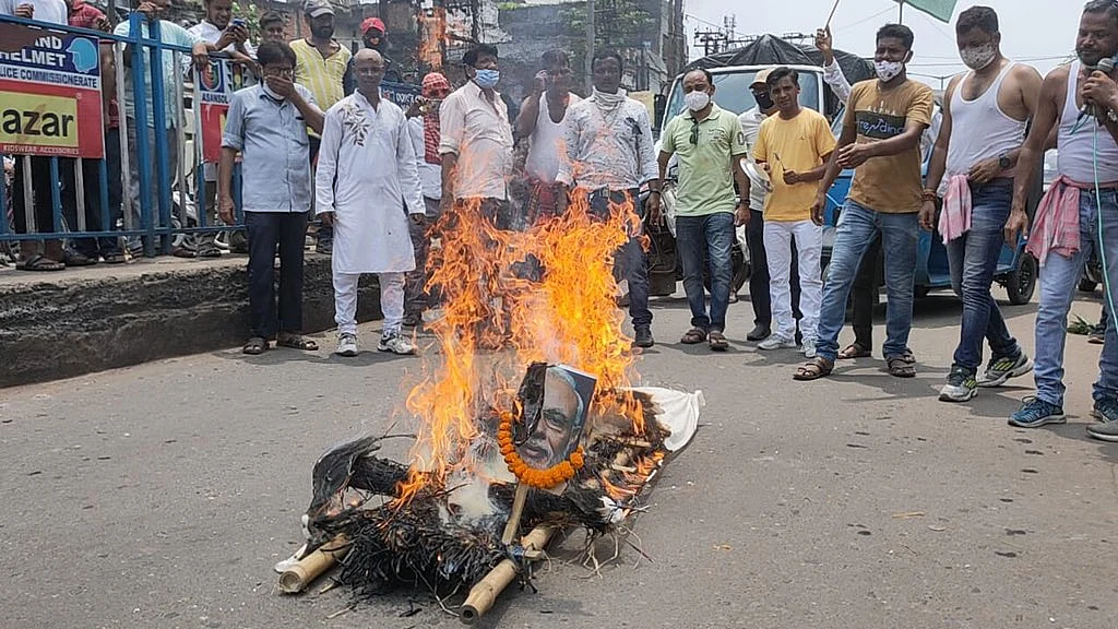 Congress workers stage protests against the constantly rising fuel prices in Asansol, West Bengal on Wednesday, July 7, 2021.
