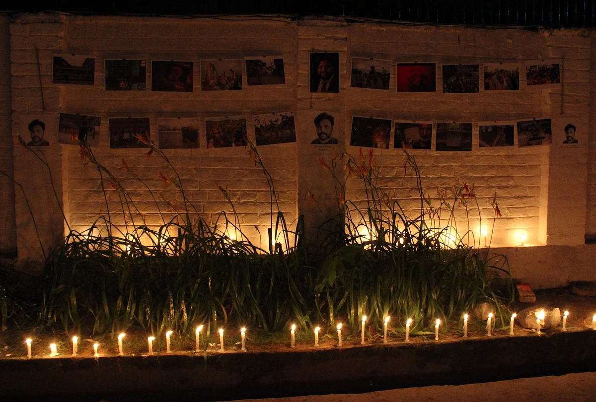 Kashmiri press photographers hold a candle vigil in memory of Reuters' photojournalist Danish Siddiqui inside the Kashmir Press Club in Srinagar, Jammu & Kashmir on July 18, 2021.