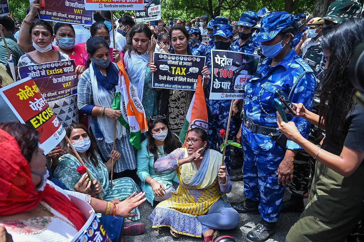 Congress party members shout slogans against the Bharatiya Janata Party (BJP) led central government during a protest against the hike in fuel prices in New Delhi on July 7, 2021.